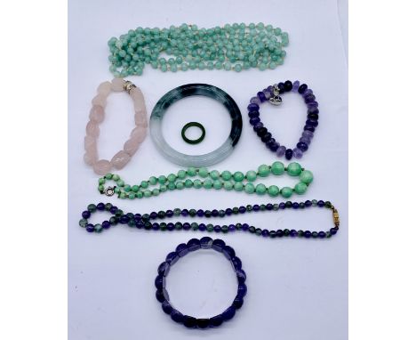 A collection of jade jewellery including an apple jade necklace etc