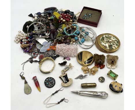 A collection of various costume jewellery, vintage compacts etc.