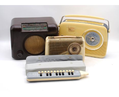 A vintage KB Rhapsody portable radio, along with a Bush TR82 portable radio, a vintage Bush bakelite radio and a vintage Hohn