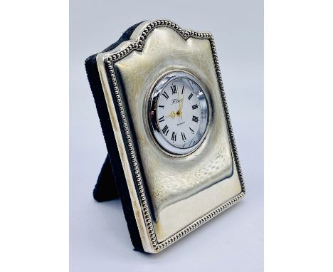 A small hallmarked silver clock, the dial signed R Carr, London