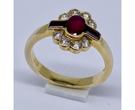 A ruby and diamond cluster ring set in 18ct gold, size M