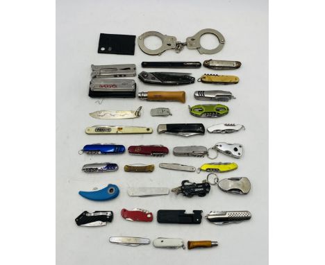 A collection of various pocket knives including Opinel, Viskase, Swiss Army etc