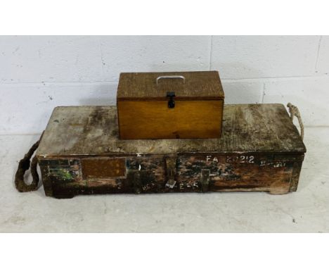 A wooden storage trunk along with a small wooden chest both containing various vintage hand tools 