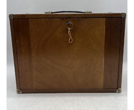 An engineers vintage wooden multi-drawer tool box with front cover and key. 