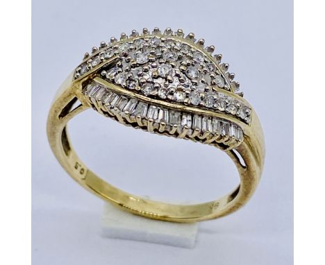 A 9ct gold dress ring set with 0.5ct of baguette and other diamonds, size Q 1/2