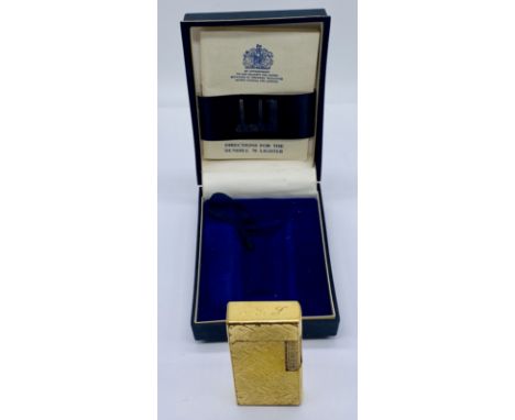 A vintage Dunhill 70 gold-plated cigarette lighter in original box with instructions