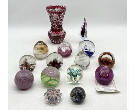 A collection of paperweights including Caithness along with a bohemian glass vase etc.