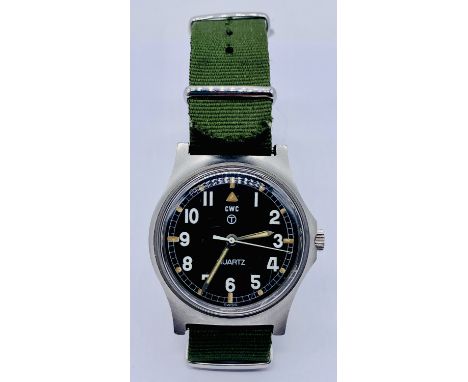 A CWC British military wristwatch with black enamelled dial and white Arabic numerals. Broad Arrow mark to reverse along with
