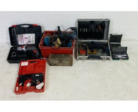 A selection of power tools including two Bosch drills, a Bosch sander plus two others, a Black & Decker heat gun, a Powerbase