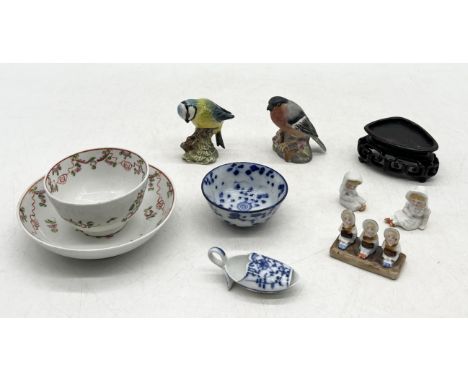 A small collection of china including Chinese tea bowl and cup, Beswick and Royal Worcester birds, antique blue and white med