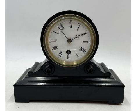A small ebonised drum head mantle clock by W.F. Wiltshire