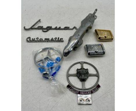 A small selection of vintage Jaguar car accessories including car bonnet mascot and Jaguar Drivers Club grill badge, lot also