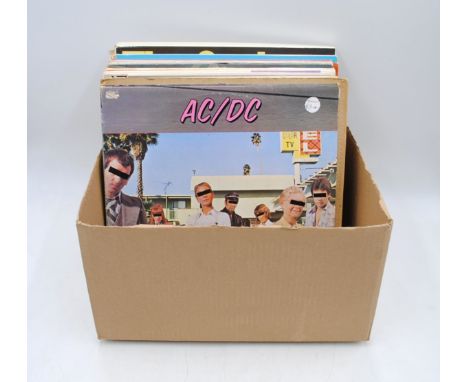 A small quantity of various 12" vinyl records, including The Faces, ACDC, The Rolling Stones, Blue Oyster Cult, Elmore James,
