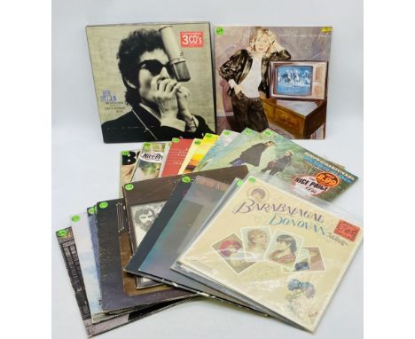 A collection of 12" vinyl records including Bob Dylan, Neil Young, Joni Mitchell, The Band, Nick Drake, Donovan, Simon & Garf