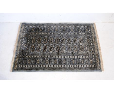 An Eastern light blue ground Bokara rug - 140cm x 95cm