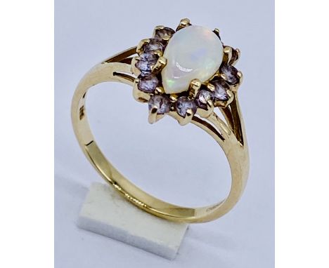 An opal cluster ring set in 9ct gold, size M