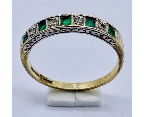 A 9ct gold emerald and diamond half eternity ring, size M