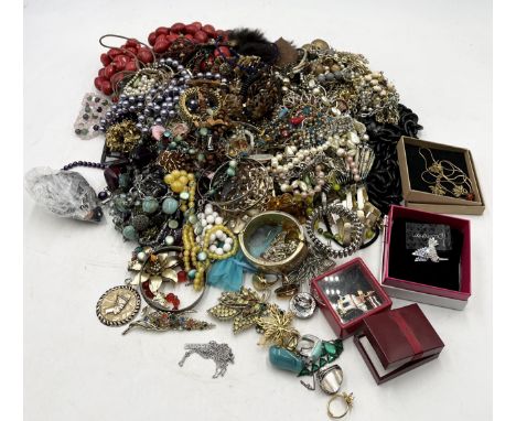 A collection of vintage costume jewellery including necklaces, beads etc.