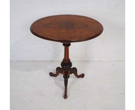 A Victorian inlaid walnut oval occasional table, raised on carved tripod base