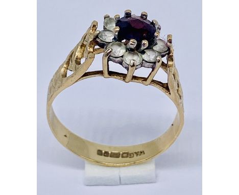 A sapphire cluster ring set in 9ct gold, size O