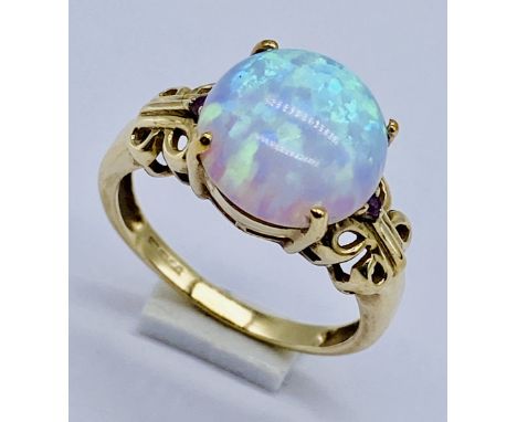 A 9ct gold ring set with an opal style stone, size N