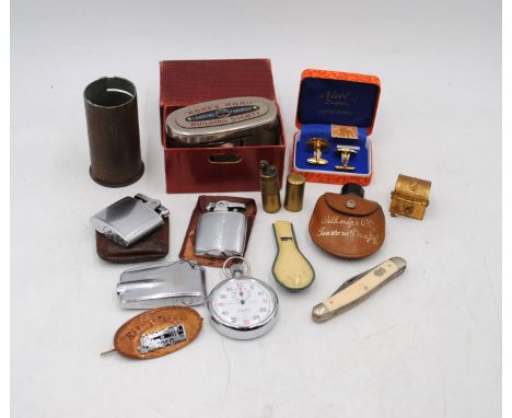 A mixed lot including a boxed "Abbey Road" building society tin, Ronson lighters, a small brass lighter, pocket knife etc.