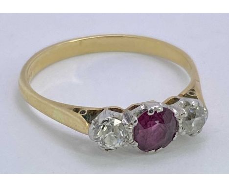 18CT GOLD THREE STONE RUBY &amp; DIAMOND RING - 0.33ct central ruby flanked by two 0.10ct diamonds, all claw set, Size O, 2.6