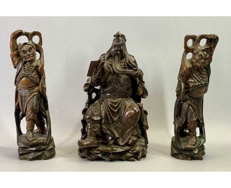 CHINESE CARVED HARDWOOD FIGURE OF A SEATED EMPEROR READING &amp; HOLDING HIS BEARD, 32cms H and two Chinese carved hardwood f