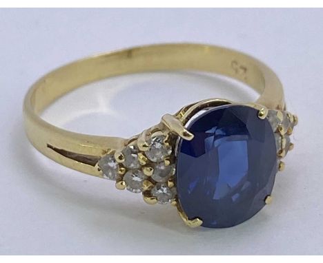 18CT GOLD BLUE SAPPHIRE &amp; DIAMOND RING - 1.5ct approx, facet cut oval sapphire, 9 x 7mm, claw set to a basket mount havin