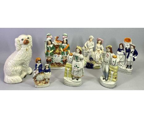 19TH CENTURY STAFFORDSHIRE PAIR OF FLATBACK FIGURES - a man and woman with ewes and flowers standing by water wells, 24cms H,