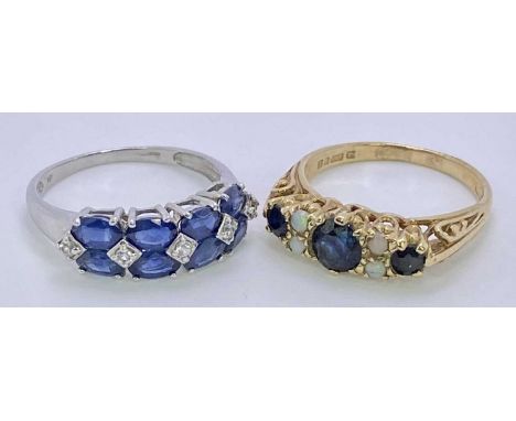 9CT GOLD DRESS RINGS (2) - to include a white gold sapphire mounted example having 8 facet cut oval blue and five inline whit