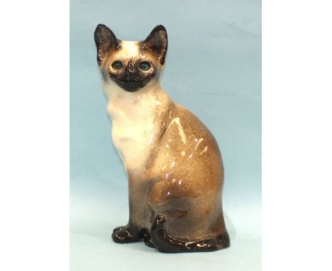A Winstanley ceramic Siamese cat, sitting, no.49, signature and 'Made in England' to base, 31.5cm high. 