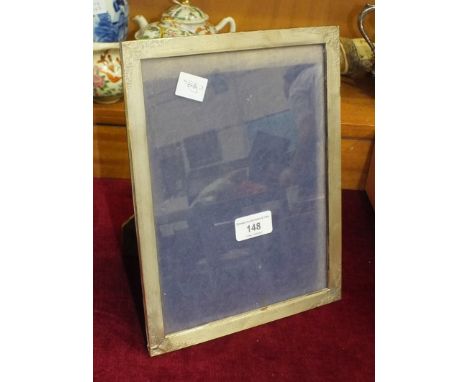 An Italian silver rectangular photo frame with engine-turned decoration stamped .925 Made in Italy, 20.5 x 26.5cm, (damage to