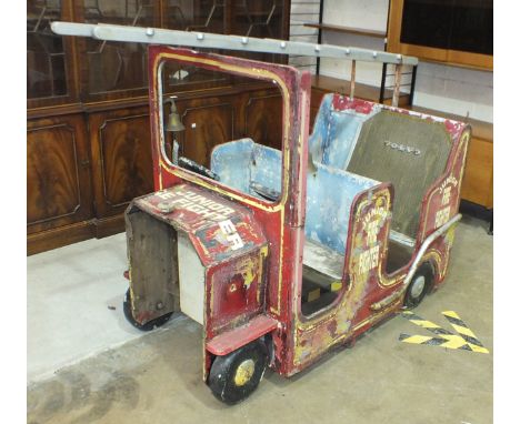 A wooden fairground ride in the form of a fire engine, 130cm long, 76cm wide, 115cm high, (in need of complete restoration).
