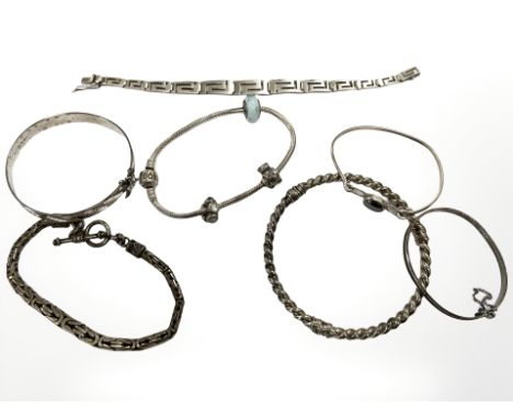 A group of silver and white metal jewellery including Pandora bracelet, silver Nymph bangle, child's bracelet etc. CONDITION 