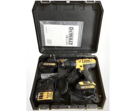 A Dewalt drill in case with instructions