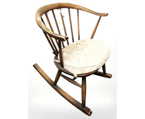 An Ercol stained elm rocking chair 