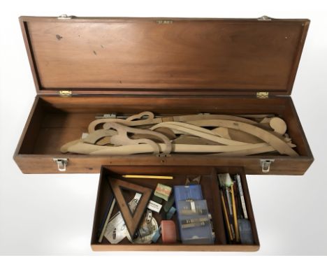 A draughtsman's box containing drawing utensils and various shapes and mouldings 