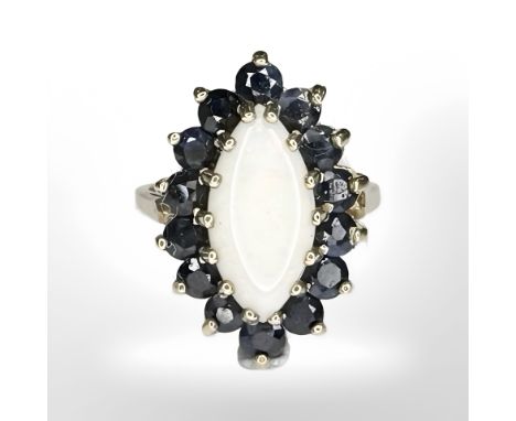 A 9ct yellow gold synthetic opal and sapphire ring, size J/K CONDITION REPORT: 4.5g.