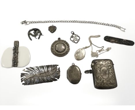 A group of silver and white metal jewellery items to include vesta case, sporting fob, brooches, pendant on chain, Swarovski 