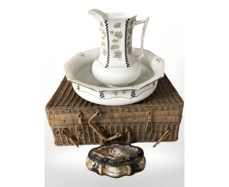 A wicker picnic hamper, a Soho Pottery Corbridge wash jug and basin, and a continental porcelain jewellery box.