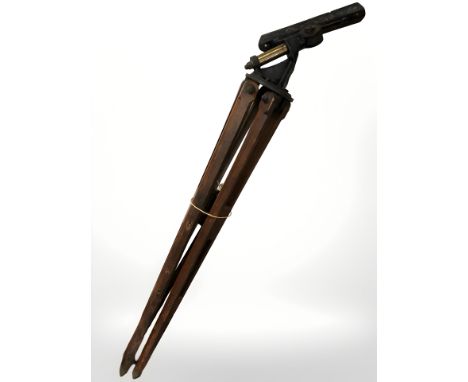 A large telescope tripod with cast iron fitting, height approximately 180 cm 