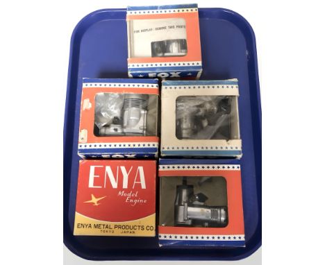 Four Fox model airplane motors and another Enya engine.