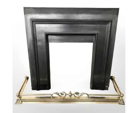A brass fire curb and cast iron fire surround 