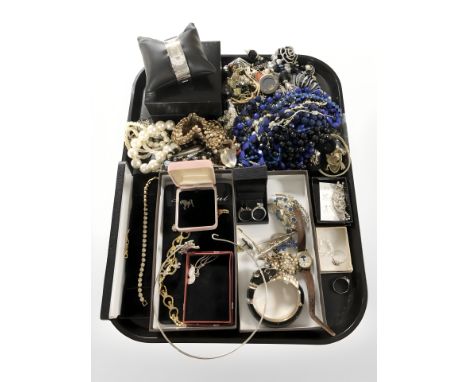Assorted costume bead necklaces, a Cartier style enameled panther bangle, ladies wristwatches, brooches, dress rings, etc. 