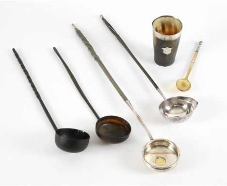White metal toddy ladle the bowl set with a George II 3p, and inscribed with a monogram and a Lamb of God, the twisted baleen
