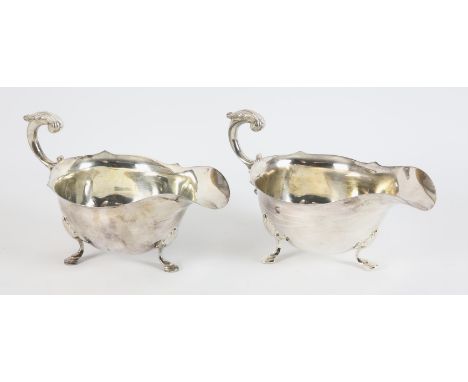 Silver gravy boat with scroll handle London 1923, and another similar London 1908 15.6ozt 486gm