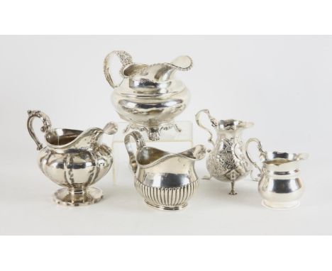 William IV cream jug Newcastle 1838, possibly by John Walton, makers mark rubbed, and four other cream jugs, various dates an