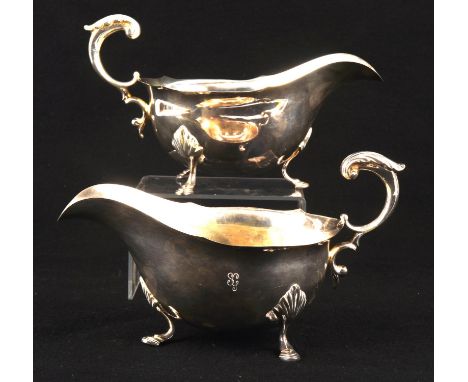 Pair of silver gravy boats with scroll handles and wavy rim on hoof feet by C J Vander Ltd, London 1959, 17.75ozt 552gm