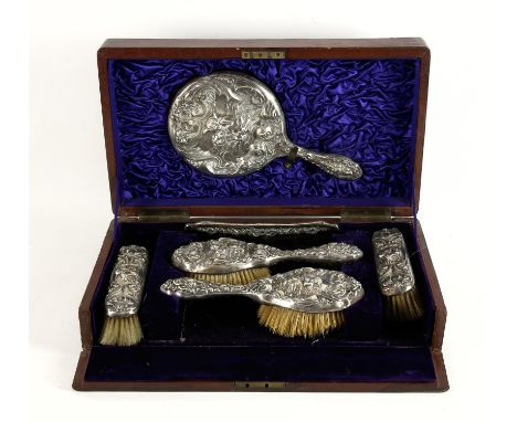 Continental silver backed brush and hand mirror set with comb, heavily embossed with a cherub and woman amongst waves, compri